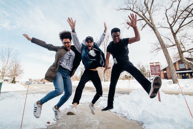 3 happy people jumping