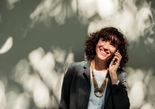 smiling woman on phone